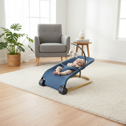 Momviacare blue fabric baby bouncer seat with wooden frame and toy bar, featuring a baby lying comfortably.