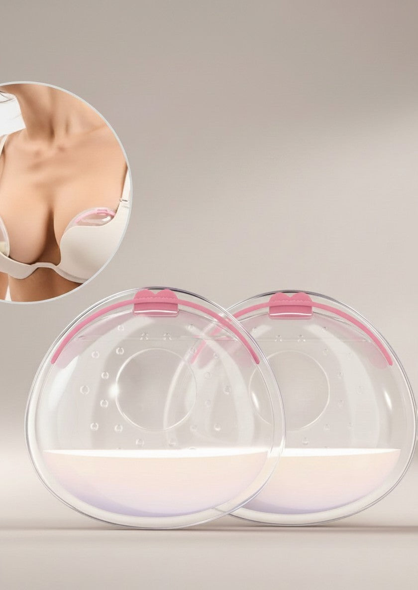 Momviacare breast milk collectors, clear BPA-free silicone with pink trim, worn discreetly inside a bra. Includes a case.