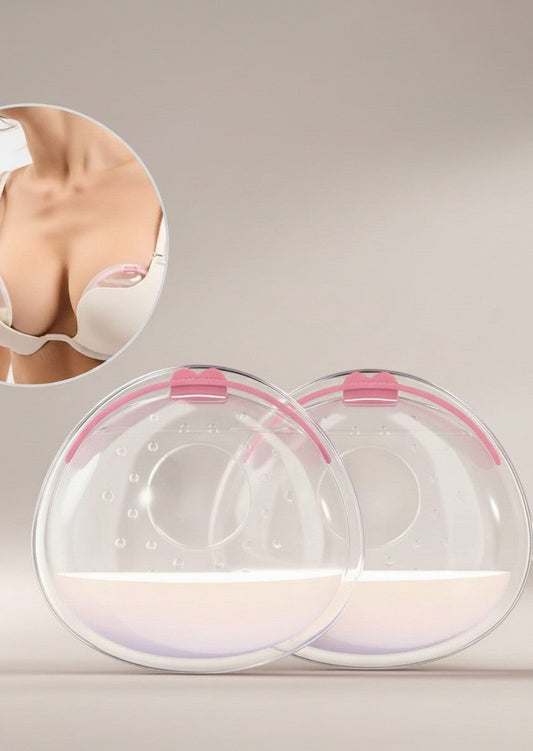 Momviacare breast milk collectors, clear BPA-free silicone with pink trim, worn discreetly inside a bra. Includes a case.