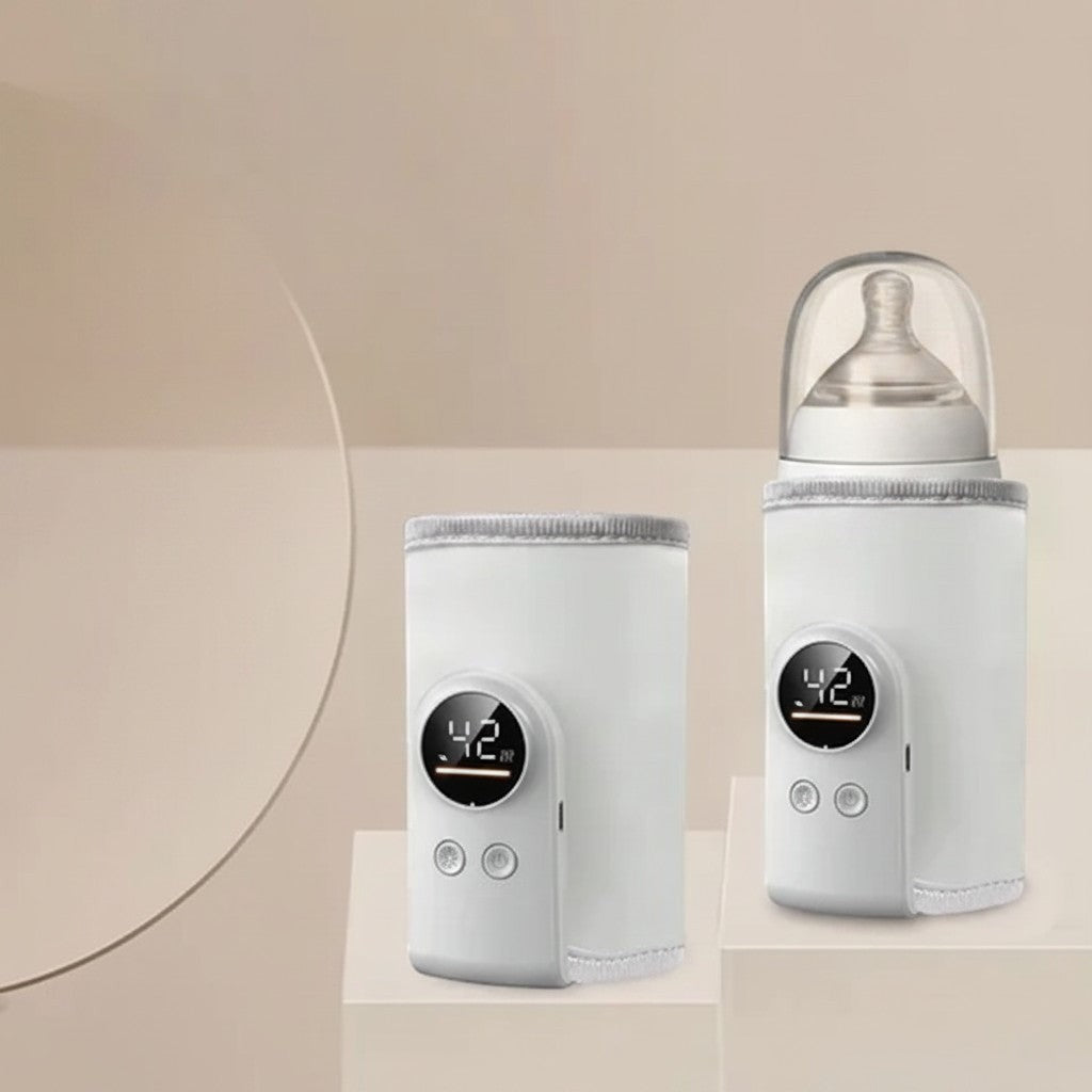 momviacare white portable bottle warmer with digital display showing 42 degrees, one with a bottle and lid